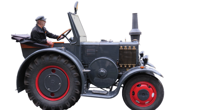 Oude landbouwmachines demonteren voor oud ijzer